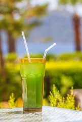 Close-up view of fruit cocktail on landscape background