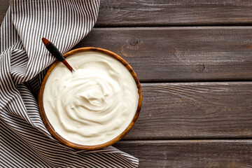 Bowl of sour cream or yogurt. Dairy product background