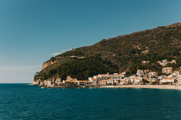 Amazing view of Petrovac town and the sea in a sunny day. Travel destination in Montenegro.