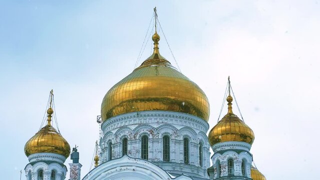 Belogorsky St. Nicholas Orthodox Missionary Monastery. Russia, Perm Krai, Belaya Gora. The temple on the hill in winter. Monastery on the background of snow. 4K