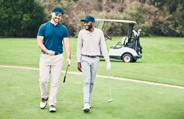 Poster Friends, sports and men on golf course walking, talking and smiling on green grass at game. Health, fitness and friendship, black man and happy golfer with smile, a walk in nature on weekend together © Clayton D/peopleimages.com