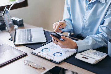 Fototapeta premium Businesswoman is checking information of new business project on