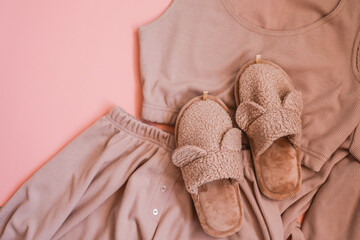 Homemade pink slippers and pajamas top view