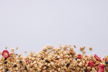 Granola close-up on a white background, space for text