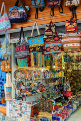 Traditional Turkish colorful handbags on store at the Selcuk Bazaar (near ancient Ephesus). Selected focus, vertical shot. Selcuk (Izmir region). Turkey (Turkiye)