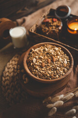 Fototapeta na wymiar Homemade granola in a wooden bowl in a homely atmosphere