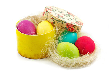 Easter concept. Handmade box full of colorful painted eggs on white background