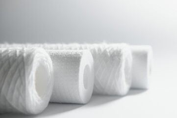 filter cartridges for water on a white background. Installation of reverse osmosis water purification system.