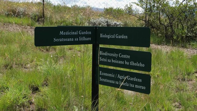 Garden sign post in English and Sesotho languages, Lesotho Africa