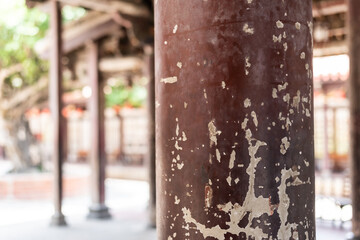aged wooden pillar with crack paint