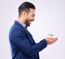 Happy man, plant in hands and business growth isolated on a white background in eco friendly investment. Asian person with sapling soil in palm for sustainable startup and green investing in studio