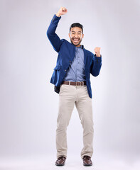 Plakat Celebration, excited and portrait of man with fist in air for, happiness, success and bonus on white background. Winner, smile and isolated happy male in studio celebrate winning, good news and deal