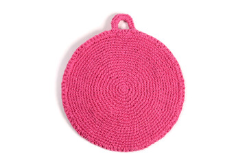 Pink handmade crochet pot holder isolated on white