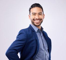 Happy, smile and portrait of a businessman in studio with a confident, proud and positive mindset. Happiness, excited and professional male employee from India standing with pride by gray background.