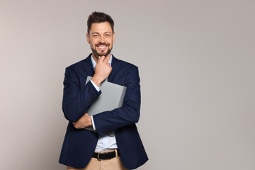 Happy teacher with stationery against beige background. Space for text