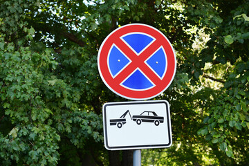 Different road signs on city street, space for text. Traffic rules