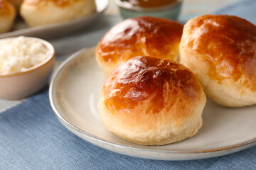 Tasty scones prepared on soda water and cottage cheese on table, closeup