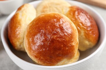 Fototapeta premium Tasty scones prepared on soda water on grey marble table, closeup