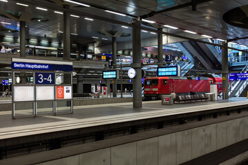 Vintage train in modern multi-level train station in urban Berlin