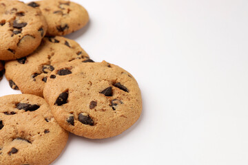 Delicious chocolate chip cookies on white background, closeup. Space for text