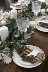 Luxury table setting with beautiful decor and blank card. Festive dinner