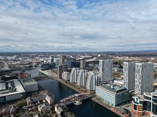 Fototapeta na wymiar Aerial view of modern buildings and landmarks next to the river. Taken in Salford Quays England. 
