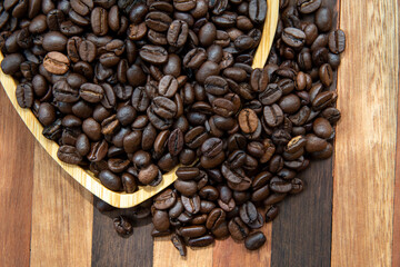 coffee beans in heart-shaped tra,y representing love of coffee