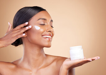 Smile, skincare or happy woman with cream product for beauty or young face isolated on studio...