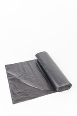 Black plastic garbage bags isolated on white background, clipping path included.