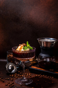 Irish Coffee Affogato, Espresso Martini Cocktail With Ice Cream Ball And Caramel Topping, On Dark Brown Background Copy Space