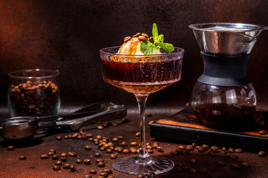 Irish Coffee Affogato, Espresso Martini Cocktail With Ice Cream Ball And Caramel Topping, On Dark Brown Background Copy Space