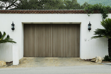 White wall with closed gates and palms. Exterior design