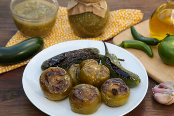 Different ingredients and tasty salsa sauce on wooden table