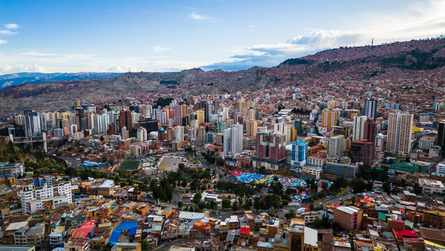 Aerial Drone Fly Above La Paz, Bolivia,  Crowder Metropolitan City, Houses, Skyscrapers and Andean Cordillera Mountain Range in the Background
