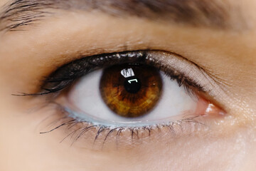 Close-up image of a female eye. A woman with beautifully drawn eyes.