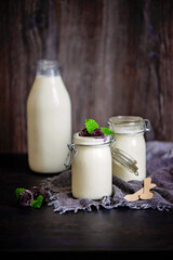Homemade yoghurt with bottle of milk