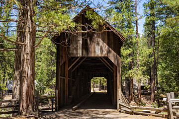 Fototapeta na wymiar Wawona historic covered bridge in Yosemite National Park, in the Pioneer Yosemite History Center.