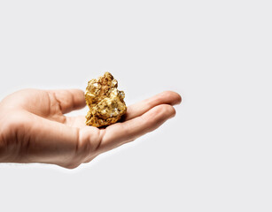 Large Gold Nugget held in a hand. Concept of Gold mining and prospecting. Isolated on white background. Illustrative Generative AI.