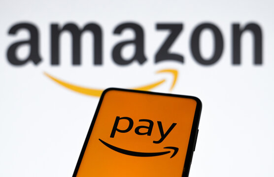 March 16, 2023, Brazil. In this photo illustration the Amazon Pay logo seen displayed on a smartphone and in the background the Amazon logo.