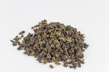 Heap of dry tea leaves isolated on white background with clipping path