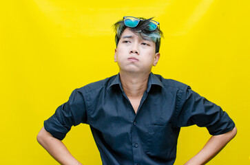 Fototapeta premium portrait of Asian man in pensive mood looks stressed, depressed, sad and messed up. An irritated man in a rage situation. stressed over the work concept.