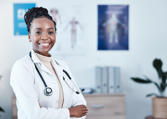 Happy, portrait and black woman doctor proud in hospital, excited or cheerful for healthcare innovation. Face, confident and female health expert smile for medical, mission or ready to help at clinic