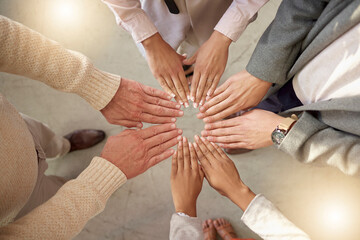 Obraz premium Teamwork, top view or hands of business people in circle for motivation, corporate community or hope together. Collaboration, diversity or support of employees meeting for our vision, growth or goals