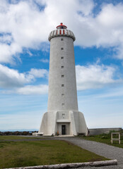 Fototapeta na wymiar Beautiful lighthouse, beacon in Iceland near sea, during amazing sunny weather, travel photo tip, traveling around the world, Akranes