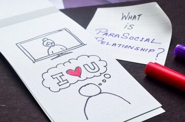What is Parasocial relationship question with it's hand drawn illustration on desk. Close-up,...