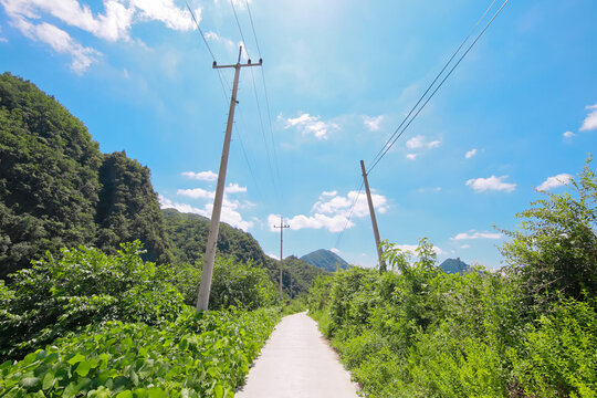 A Secluded Rural Neighborhood In Southeast Asia Where A Telephone Pole Is Placed