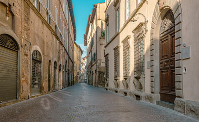 Fototapeta na wymiar The old city of Lucca. Street of the medieval city - Tuscany region in central Italy - may 30, 2021