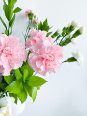Close up photo of a bouquet of pink carnations