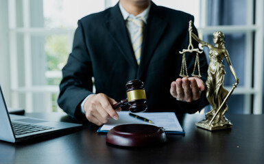 Court of Justice and Judicial: Male Public Defender Writes Arguments for Defense Strategy A...
