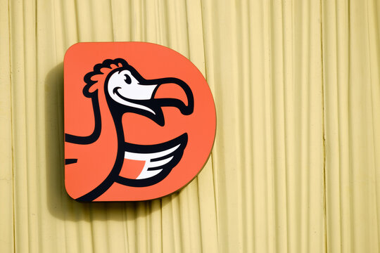 MINSK, BELARUS - FEBRUARY 20, 2022: Dodo pizza. Logo, sign on the wall of a shopping center in Minsk (Belarus).